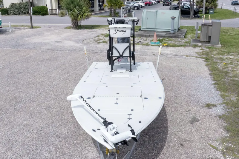 Slide: The Image of 2012 Young GulfShore 20 boat parked on pavement, featuring a sleek design and modern equipment. - 10