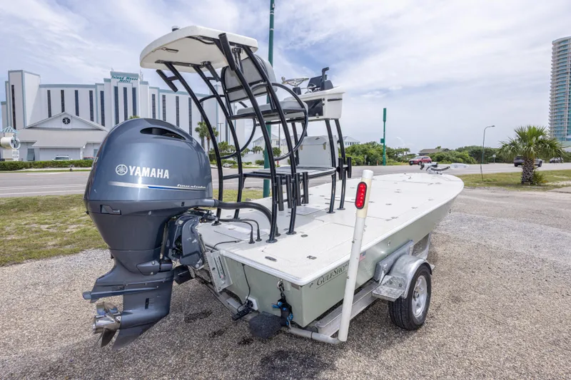 Slide: The Image of 2012 Young GulfShore 20 boat with Yamaha engine on trailer, parked near buildings. - 11