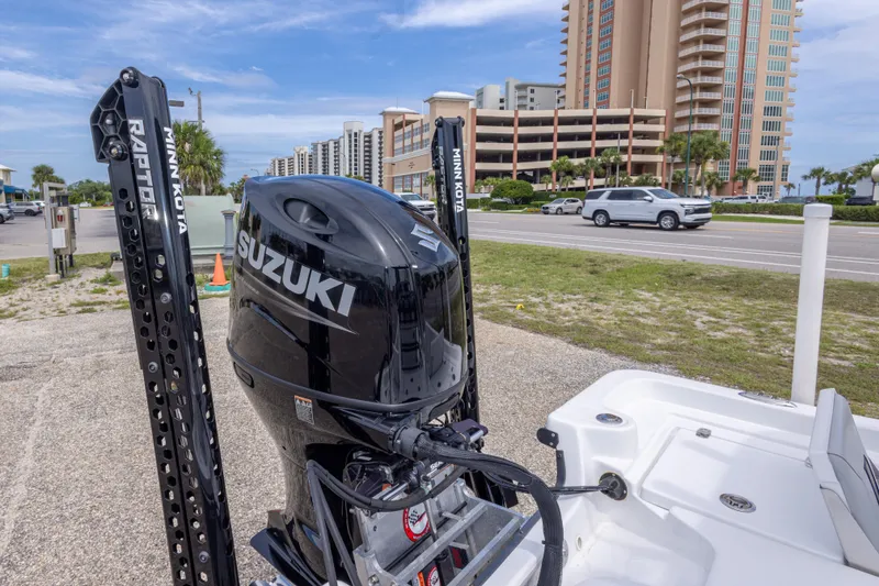 Slide: The Image of 2012 Young GulfShore 20 boat with Suzuki motor, parked near a coastal road. - 19