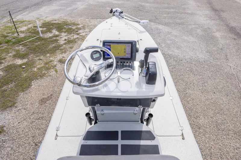 Slide: The Image of 2012 Young GulfShore 20 boat console with steering wheel and navigation equipment. - 32