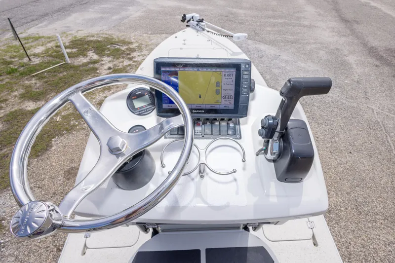 Slide: The Image of Steering console of 2012 Young GulfShore 20 boat with navigation equipment. - 33