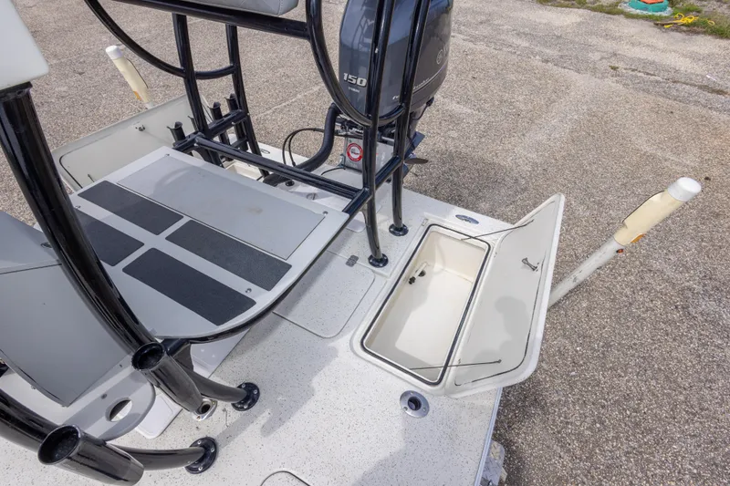 Slide: The Image of 2012 Young GulfShore 20 boat deck with open storage compartment and motor. - 38