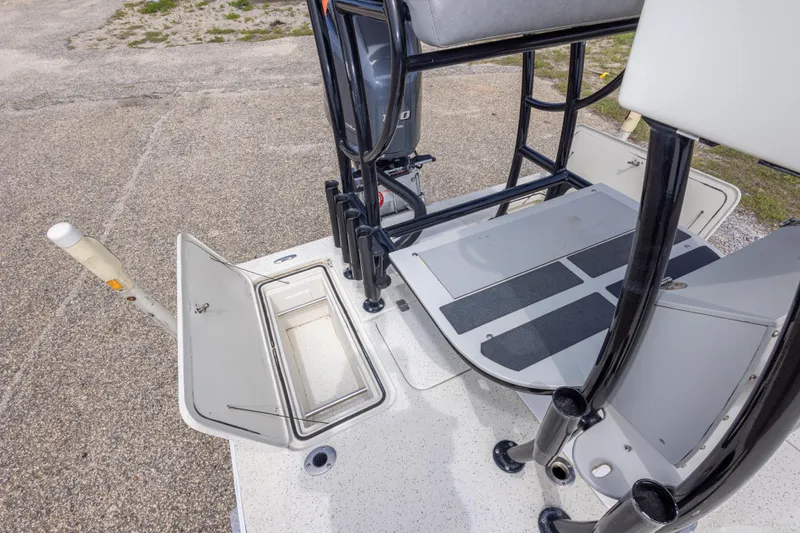 Slide: The Image of 2012 Young GulfShore 20 boat interior with open storage compartment and seating area. - 39