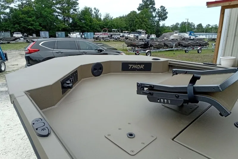 Slide: The Image of Boat deck of 2026 Thor 1900 Lake Hammer, featuring control panel and seating. - 35