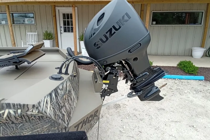 Slide: The Image of Boat with Suzuki outboard motor, Thor 1900 Lake Hammer model, 2026. - 37