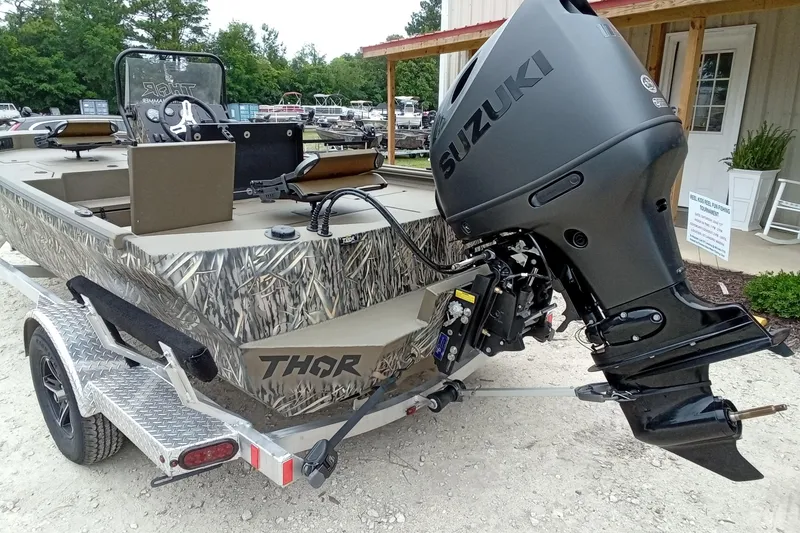 Slide: The Image of 2026 Thor 1900 Lake Hammer boat with Suzuki outboard motor on trailer. - 38