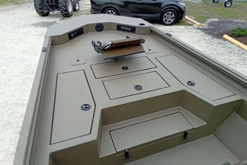 Slide: The Image of 2026 Thor 1900 Lake Hammer boat interior with storage compartments and seating. - 41