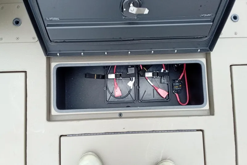 Slide: The Image of Open storage compartment in 2026 Thor 1900 Lake Hammer boat, showing wiring and connections. - 44
