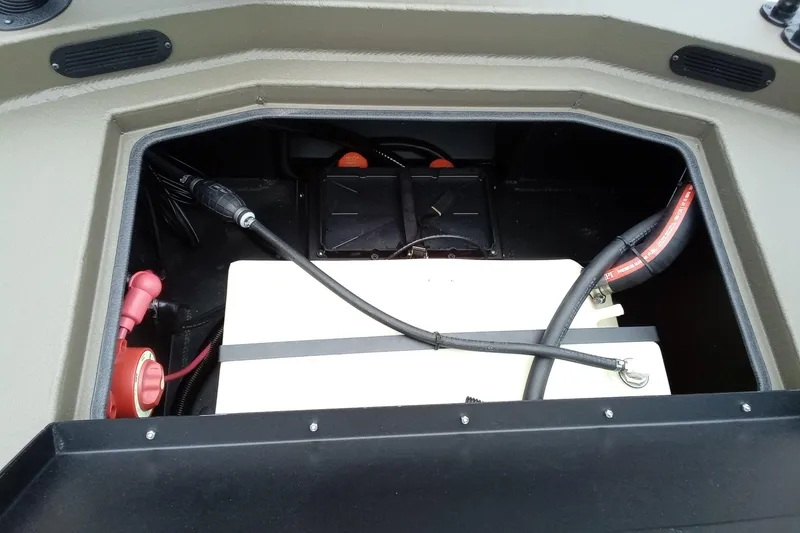 Slide: The Image of Battery compartment of 2026 Thor 1900 Lake Hammer boat, featuring cables and connectors. - 47