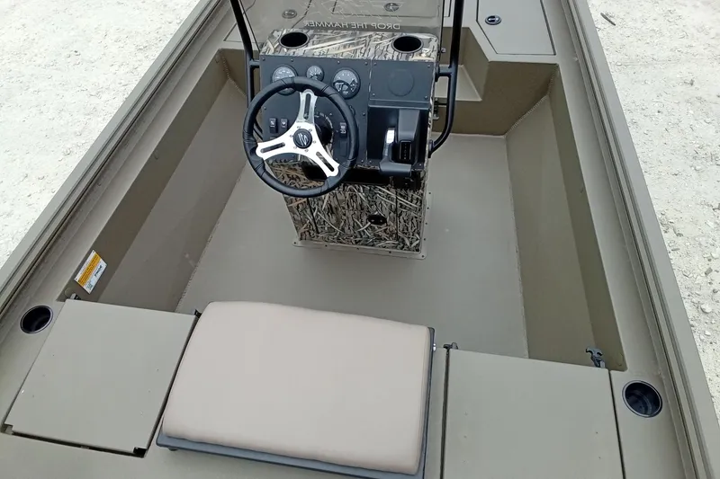 Slide: The Image of 2026 Thor 1900 Lake Hammer boat interior with steering wheel and seating. - 49