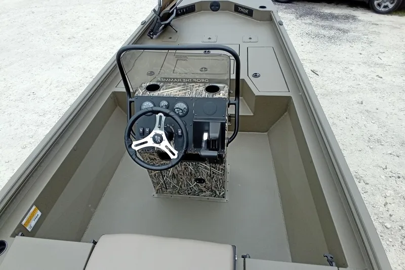 Slide: The Image of Interior view of 2026 Thor 1900 Lake Hammer boat, featuring steering console and controls. - 50