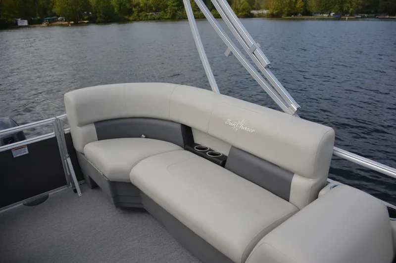 Slide: The Image of Manufacturer Provided Image: 2024 SunChaser Vista 18 LR pontoon boat with comfortable seating on a serene lake. - 10