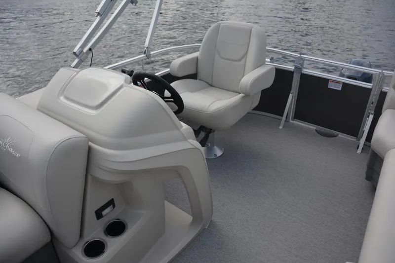 Slide: The Image of Manufacturer Provided Image: 2024 SunChaser Vista 18 LR boat interior with captain's chair and steering console. - 13