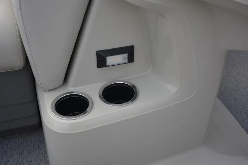Slide: The Image of Manufacturer Provided Image: 2024 SunChaser Vista 18 LR boat interior cup holders and storage compartment. - 17