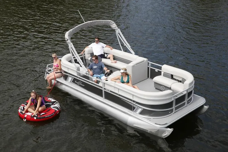 Slide: The Image of Manufacturer Provided Image: 2024 SunChaser Vista 18 LR pontoon boat on water with people relaxing and tubing. - 5