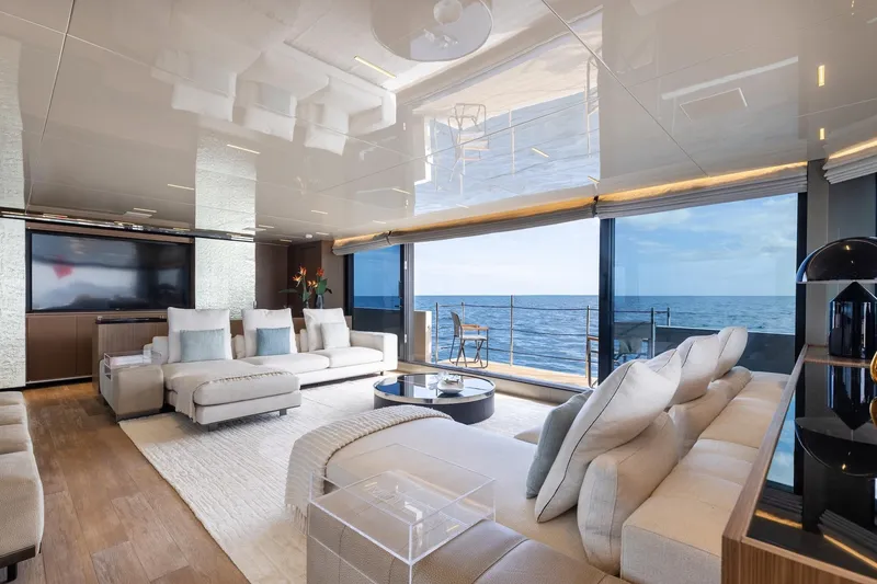 Slide: The Image of Luxurious 2020 Sanlorenzo SLA120A yacht interior with ocean view, modern decor, and plush seating. - 12