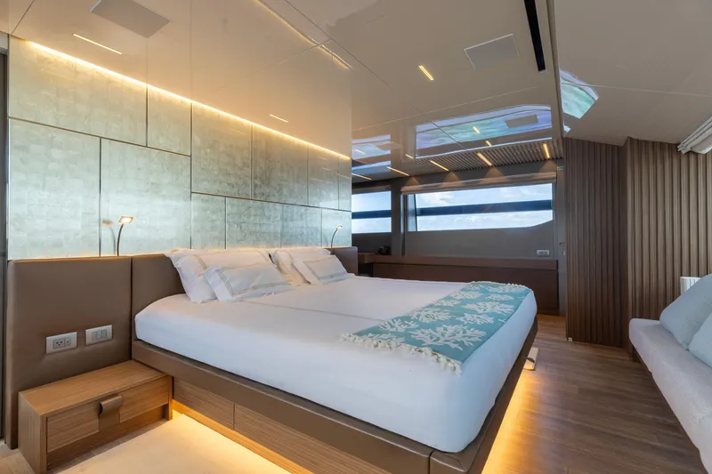 Slide: The Image of Luxurious bedroom interior on 2022 Sanlorenzo SL120A yacht, featuring modern design and ambient lighting. - 24