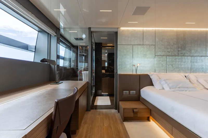 Slide: The Image of Luxurious Sanlorenzo SL120A 2022 yacht interior with modern bedroom and workspace design. - 25