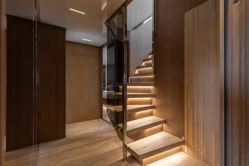 Slide: The Image of Luxurious interior of 2020 Sanlorenzo SLA120A yacht with modern wooden staircase. - 28