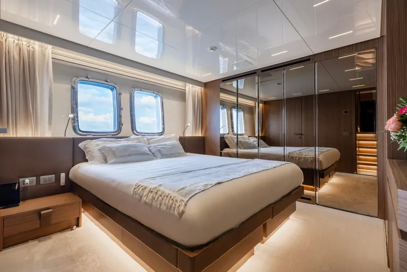 Slide: The Image of Luxurious bedroom interior of 2022 Sanlorenzo SL120A yacht with elegant design and mirrored walls. - 29