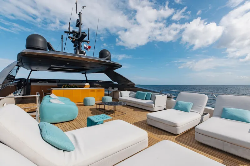 Slide: The Image of Luxurious Sanlorenzo SLA120A yacht deck with modern seating, ocean view, and clear blue sky. - 34
