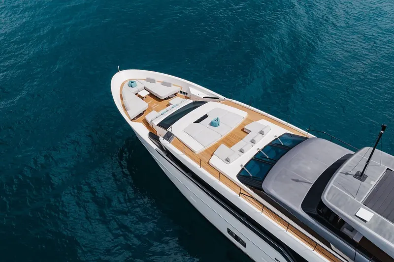 Slide: The Image of Luxurious 2020 Sanlorenzo SLA120A yacht on clear blue water, featuring elegant deck seating. - 8