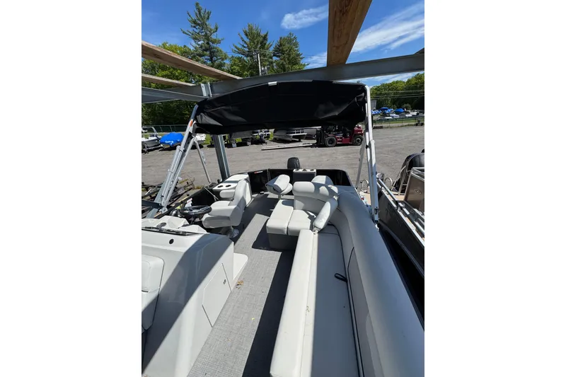 The Image of 2023 Crest CLASSIC LX FISH 200 C4 pontoon boat with spacious seating and canopy. - 1