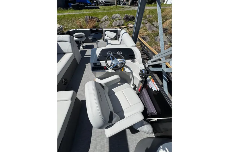 Slide: The Image of 2023 Crest CLASSIC LX FISH 200 C4 boat interior with steering wheel and seating. - 10
