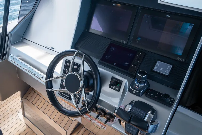 Slide: The Image of Steering console of 2022 Novamarine BS 160 Outboard with modern navigation displays. - 27