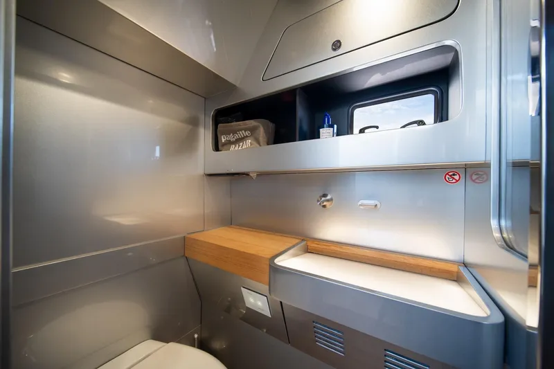 Slide: The Image of Modern bathroom interior of 2022 Novamarine BS 160 Outboard boat, featuring sleek design and storage. - 33