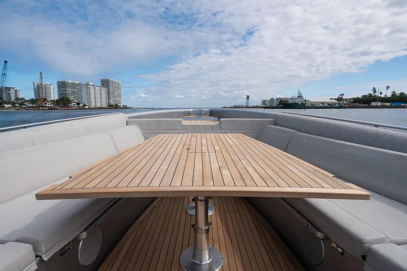 Slide: The Image of Novamarine BS 160 Outboard 2022 boat with spacious deck and seating, cityscape in background. - 40