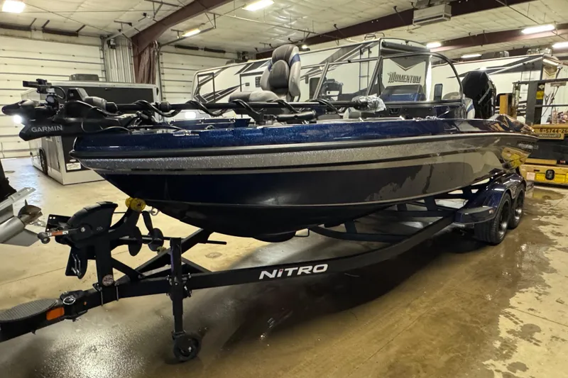 Slide: The Image of 2026 Nitro ZV21 Pro boat on trailer in indoor storage facility. - 1