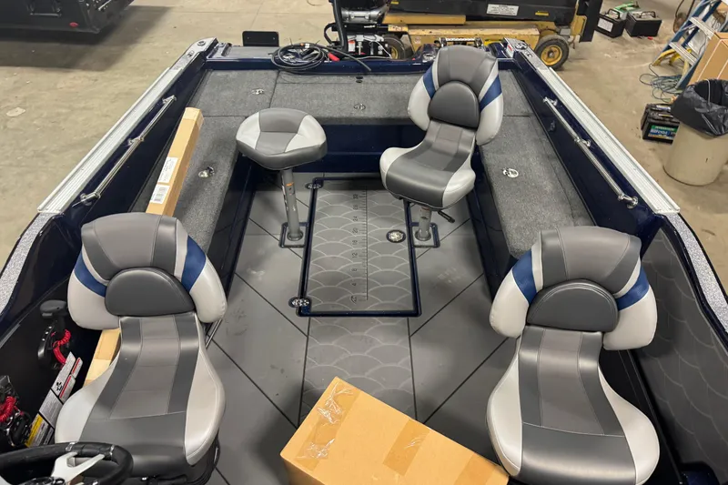 Slide: The Image of Interior of 2026 Nitro ZV21 Pro boat with four gray seats and storage compartments. - 12