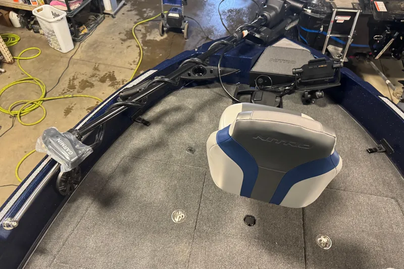 Slide: The Image of Nitro ZV21 Pro 2026 boat interior with Garmin equipment and seating. - 13