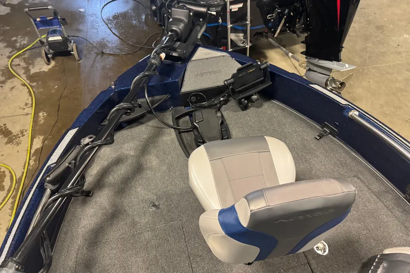 Slide: The Image of 2026 Nitro ZV21 Pro boat interior with steering and seating. - 14