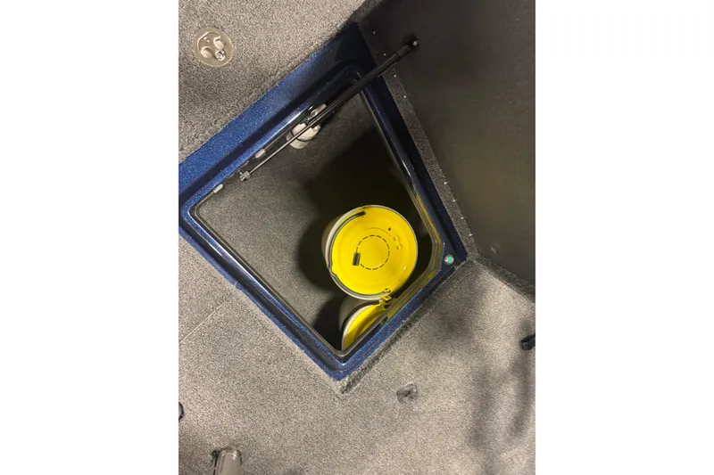 Slide: The Image of Storage compartment in 2026 Nitro ZV21 Pro boat with yellow bucket inside. - 17