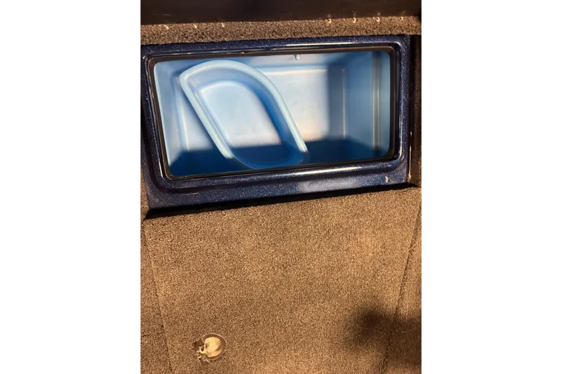 Slide: The Image of Interior compartment of 2026 Nitro ZV21 Pro boat, featuring a blue storage area. - 18