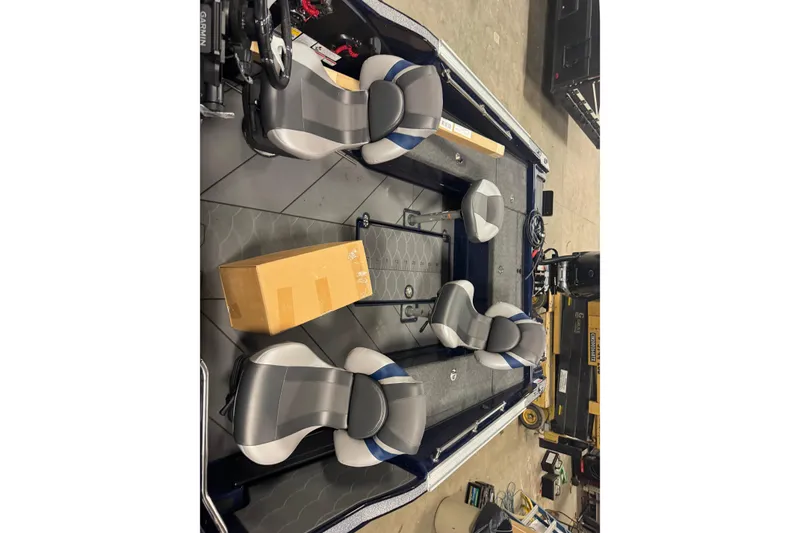 Slide: The Image of 2026 Nitro ZV21 Pro boat interior with four seats and a cardboard box. - 19