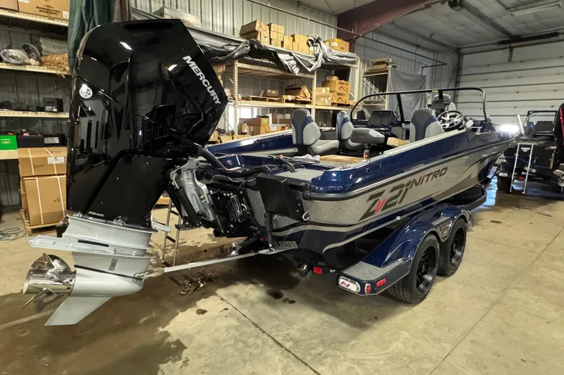 Slide: The Image of 2026 Nitro ZV21 Pro boat in a garage, featuring a powerful Mercury engine. - 3