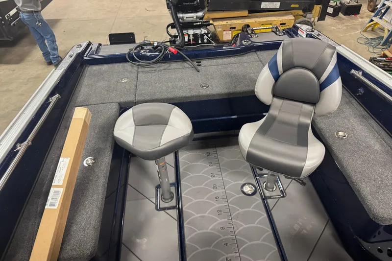 Slide: The Image of Interior of a 2026 Nitro ZV21 Pro boat with two seats and a measuring mat. - 8