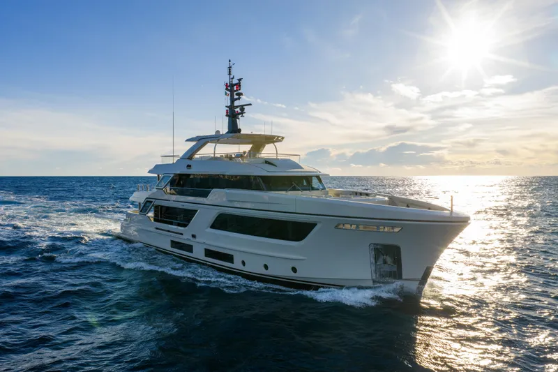 Slide: The Image of Luxurious 2023 Cantiere Delle Marche RJ 115 yacht cruising at sunset on open sea. - 0