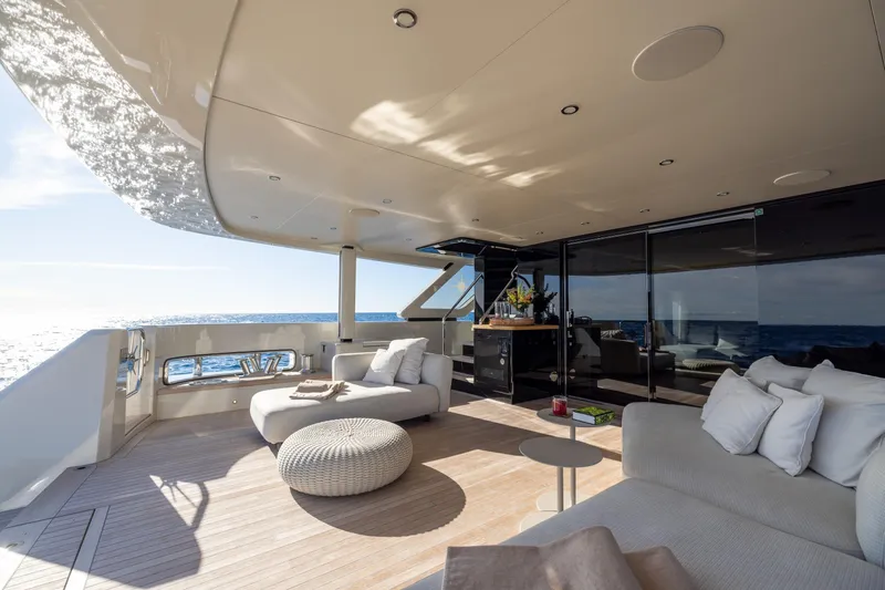 Slide: The Image of Luxurious 2023 Cantiere Delle Marche RJ 115 yacht deck with elegant seating and ocean view. - 10