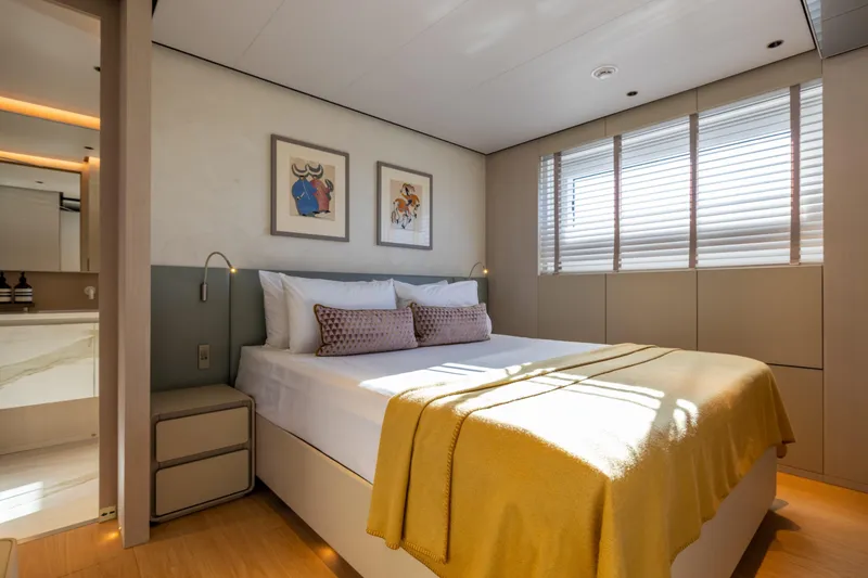 Slide: The Image of Luxurious bedroom interior on 2023 Cantiere Delle Marche RJ 115 yacht, featuring modern decor and natural light. - 21