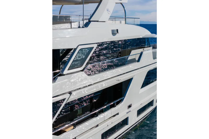 Slide: The Image of Modern 2023 Cantiere Delle Marche RJ 115 yacht reflecting sunlight on the ocean. - 39