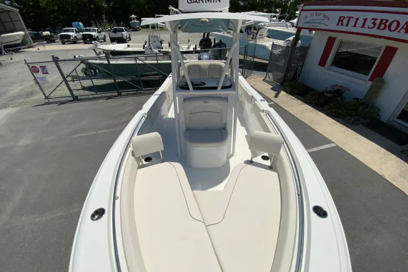 Slide: The Image of 2024 Sea Hunt Ultra 234 boat with Garmin equipment, parked at a dealership. - 26