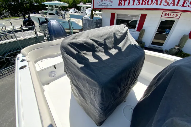 Slide: The Image of 2024 Sea Hunt Ultra 234 boat with covered console at dealership. - 37