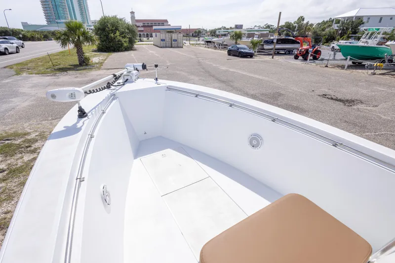 Slide: The Image of 1998 Contender 21 CC boat at dockside, featuring spacious deck and modern equipment. - 30