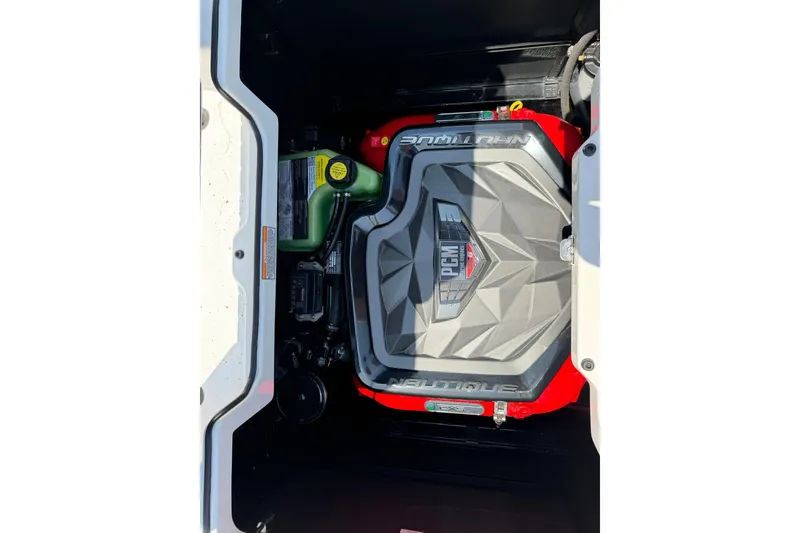 Slide: The Image of 2022 Nautique Super Air Nautique G23 engine compartment with PCM engine visible. - 14