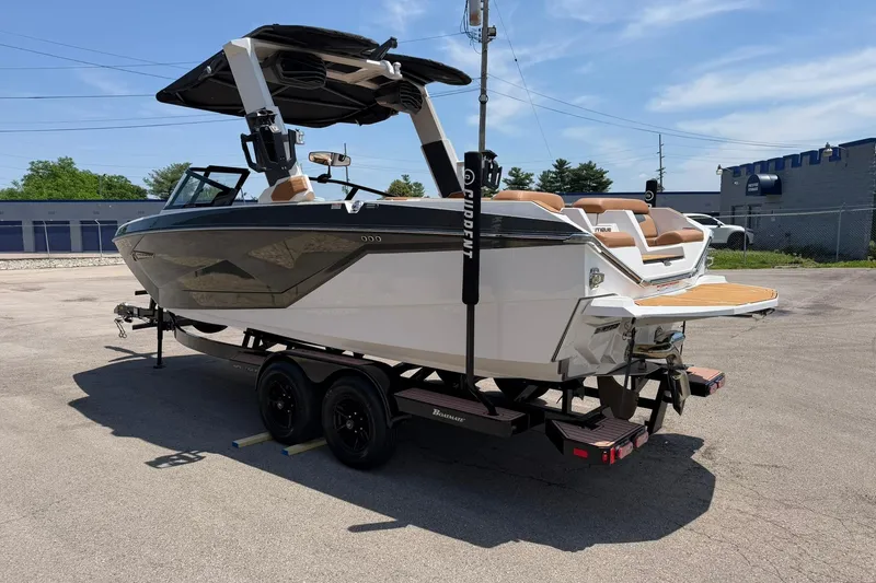 Slide: The Image of 2022 Nautique Super Air Nautique G23 boat on trailer in parking lot. - 5