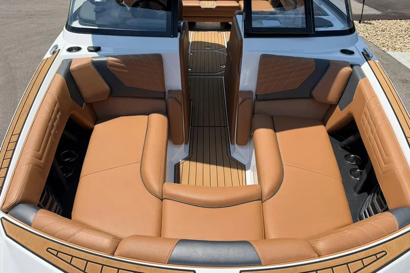 Slide: The Image of Luxurious interior of 2022 Nautique Super Air Nautique G23 boat with tan leather seating. - 8